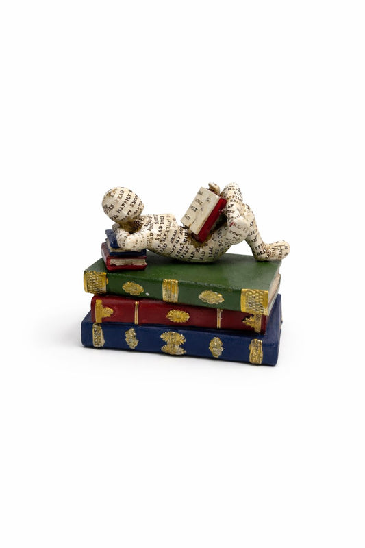 Reclining Reader Sculpture on Decorative Books