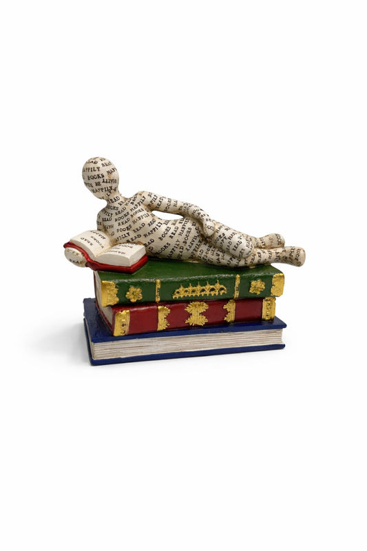 Reclining Reader Sculpture on Decorative Books